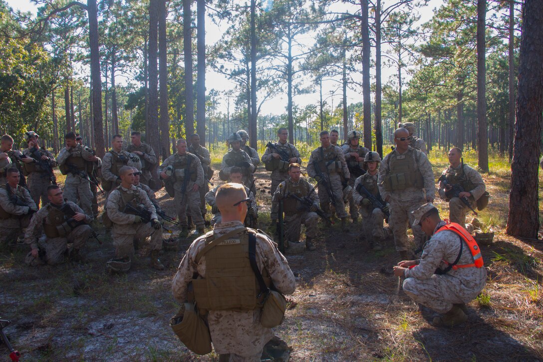 Marines of Company K, Battalion Landing Team (BLT) 3/2, currently reinforcing the 26th Marine Expeditionary Unit (MEU), debrief after a practice raid during the mechanized raid course at Camp Lejeune, N.C., Oct. 10, 2012. BLT 3/2 is one of the three reinforcements of 26th MEU, which is slated to deploy in 2013.