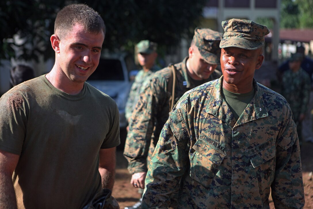 Lance Cpl. Matthew Lehman, foreman with Combat Logistics Battalion 31, 31st Marine Expeditionary Unit and a native of Bellwood, PA., (left) stands with B. Gen. Craig Timberlake, commanding general of the 3rd Marine Expeditionary Brigade as they overlook the progress of the Macasascas Elementary School engineering civil affairs construction project here, Oct. 15. Timberlake visited various current and previous ENCAP sites during the 31st MEUs projects in Palawan to oversee the progress and visit the local Filipinos who benefit fromthe projects. The ENCAPs are one of multiple humanitarian civil affairs projects conducted by the 31st MEU throughout the island of Palawan during the Amphibious Landing Exercise in the Philippines. PHIBLEX, now in its 29th iteration, is an annually-scheduled exercise between the U.S. and Philippine forces, aimed at strengthening military-to-military interoperability and bilateral relationships.