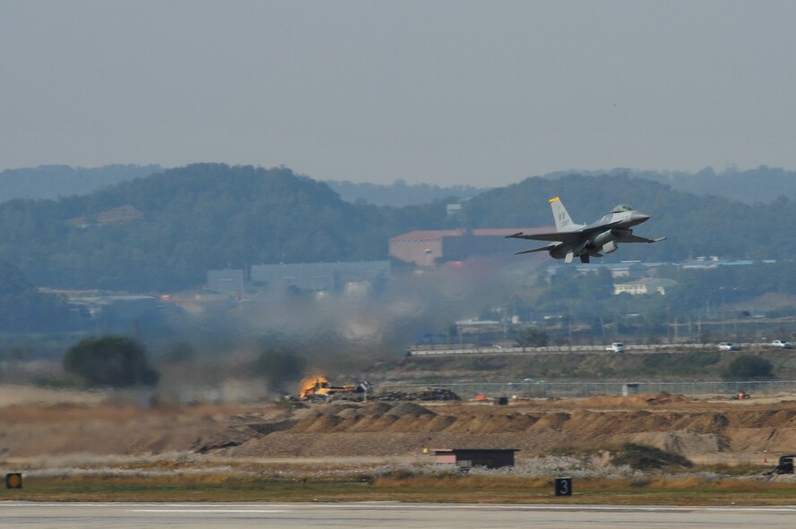An F-16 Fighting Falcon takes off for an aerial demonstration during Air Power Day 2012 at Osan Air Base, Republic of Korea, Oct. 20, 2012. Air Power Day 2012 represents an annual opportunity for the United States to showcase its military personnel and equipment to a global audience. The airshow highlights the relationship between the 51st Fighter Wing and the Republic of Korea through public demonstrations of military equipment and personnel. (U.S. Air Force photo/Staff Sgt. Craig Cisek)