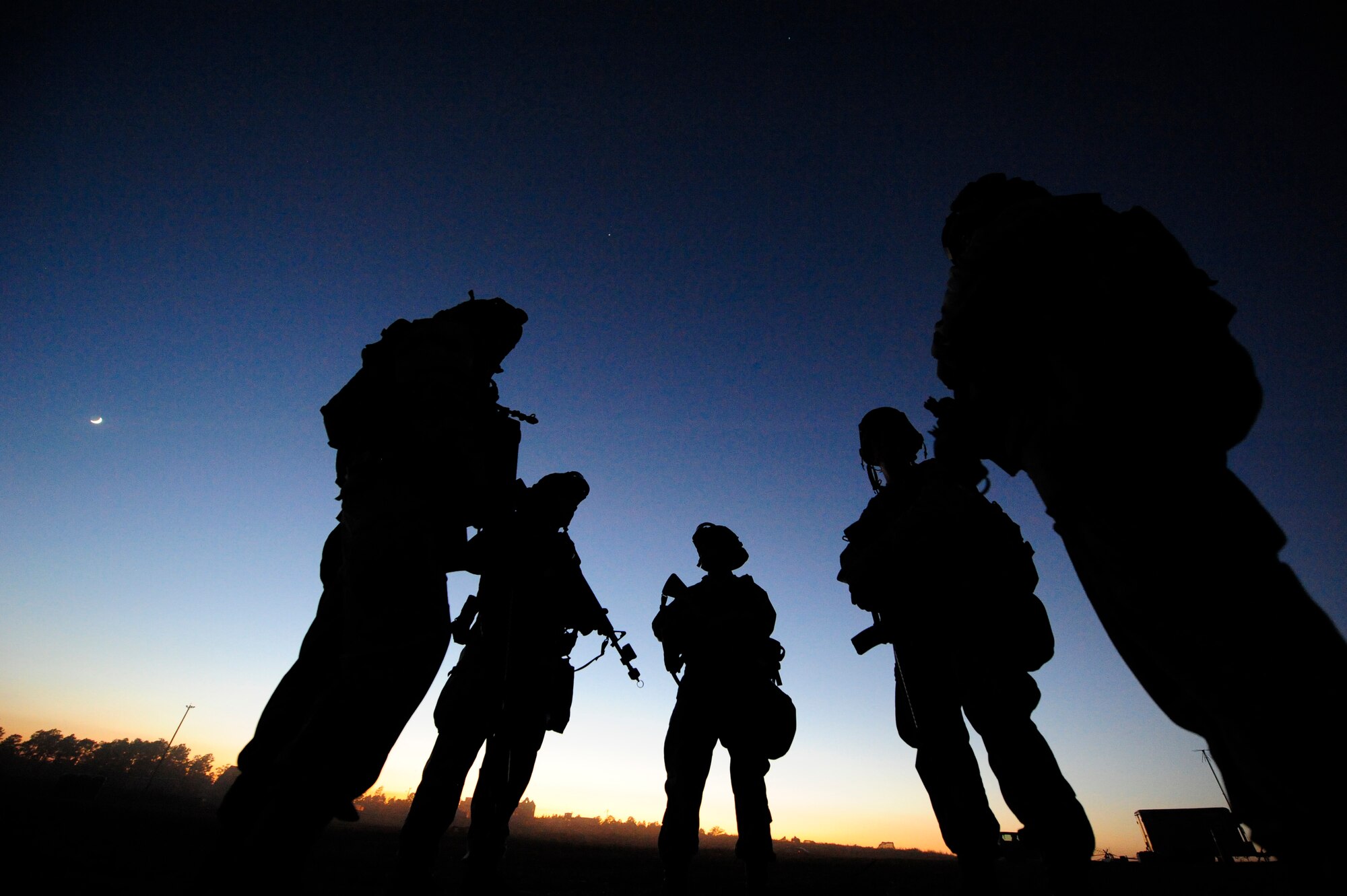 FORT POLK, La. – Airmen from the 570th Contingency Response Group at Travis Air Force Base, Calif., stand outside the group command post at Geronimo Landing Zone on Fort Polk, La. Oct 18, 2012.   The CRG was supporting Joint Readiness Training Center Exercise Decisive Action. The exercise includes emphasis on joint forcible entry, phased deployment with an airborne parachute operation, a combined noncombatant evacuation, combine arms maneuver, wide area security, unconventional warfare and unified land operations in a joint, interagency, intergovernmental and multinational environment. (U.S. Air Force photo by Tech. Sgt.  Parker Gyokeres) (Released)