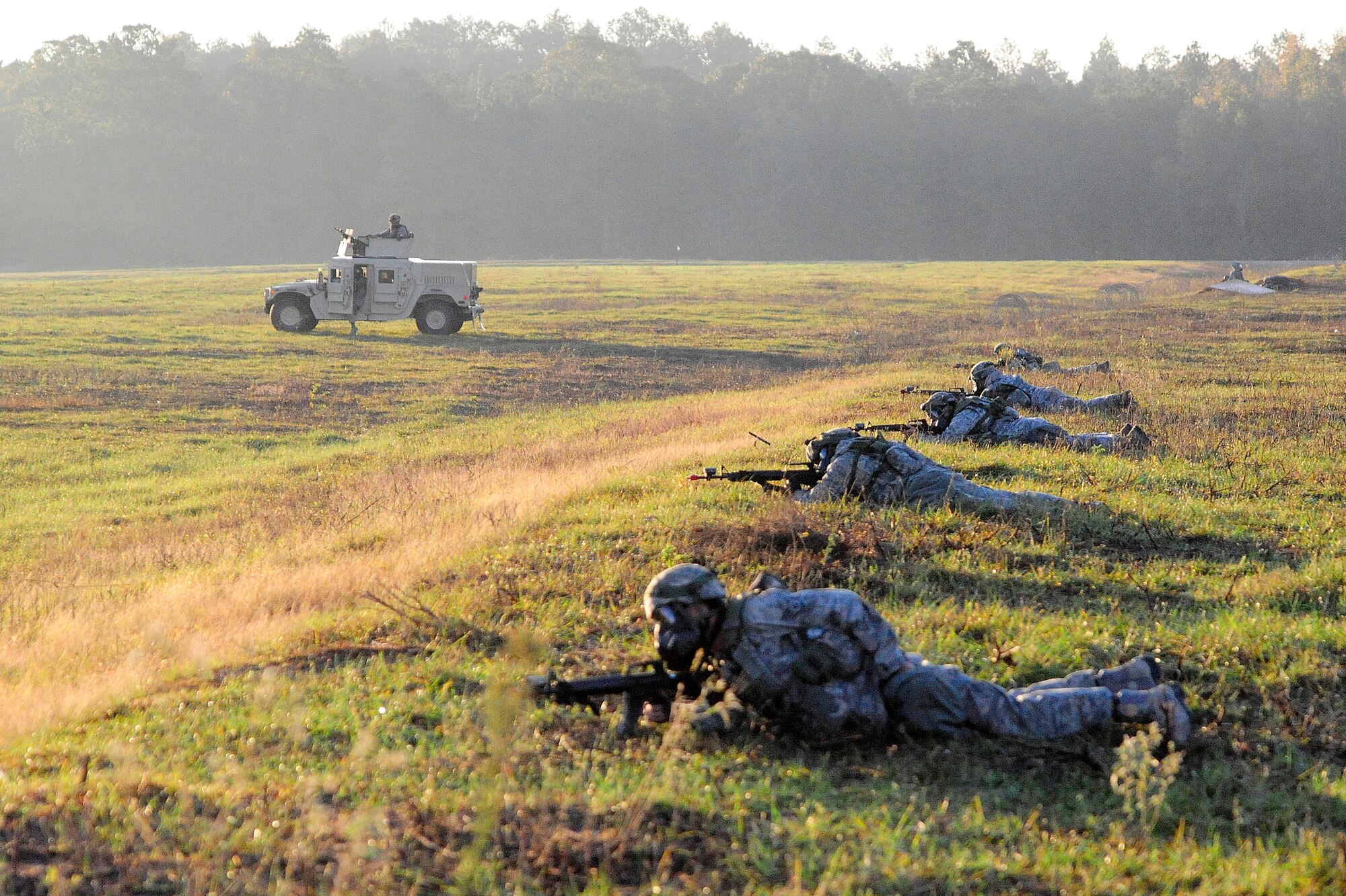 FORT POLK, La. – Airmen from the 570th Contingency Response Group at Travis Air Force Base, Calif., guard the group compound at Geronimo Landing Zone on Fort Polk, La. Oct 18, 2012.   The CRG was supporting Joint Readiness Training Center - Decisive Action. The exercise includes emphasis on joint forcible entry, phased deployment with an airborne parachute operation, a combined noncombatant evacuation, combine arms maneuver, wide area security, unconventional warfare and unified land operations in a joint, interagency, intergovernmental and multinational environment. (U.S. Air Force photo by Tech. Sgt.  Parker Gyokeres) (Released)