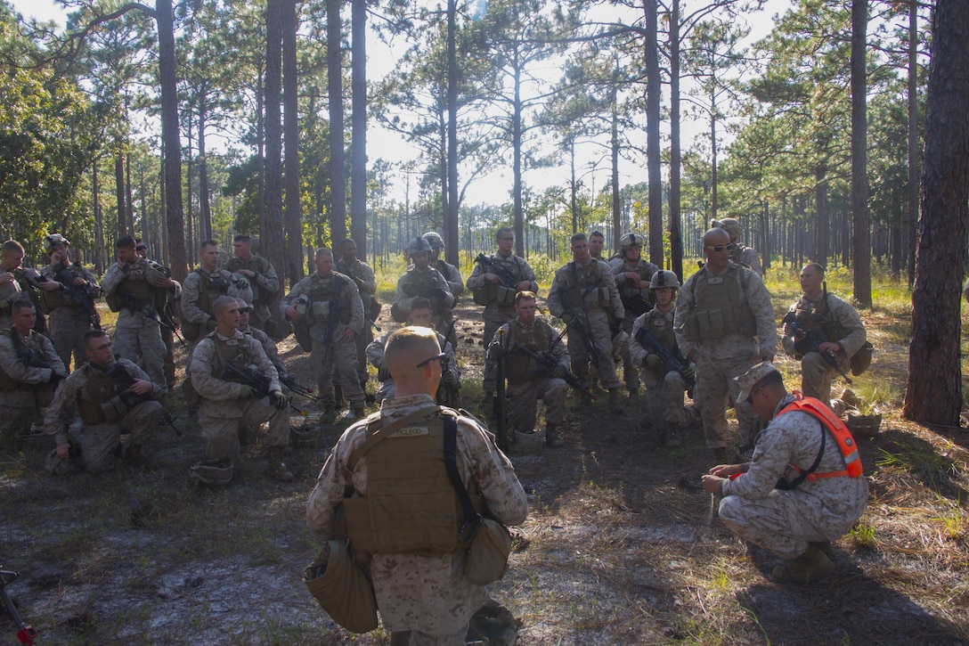 Marines of Company K, Battalion Landing Team (BLT) 3/2, currently reinforcing the 26th Marine Expeditionary Unit (MEU), debrief after a practice raid during the mechanized raid course at Camp Lejeune, N.C., Oct. 10, 2012. BLT 3/2 is one of the three reinforcements of 26th MEU, which is slated to deploy in 2013.