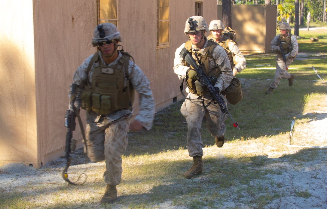 Marines of Company K, Battalion Landing Team (BLT) 3/2, currently reinforcing the 26th Marine Expeditionary Unit (MEU), egress from the objective during the mechanized raid course at Camp Lejeune, N.C., Oct. 10, 2012. BLT 3/2 is one of the three reinforcements of 26th MEU, which is slated to deploy in 2013.