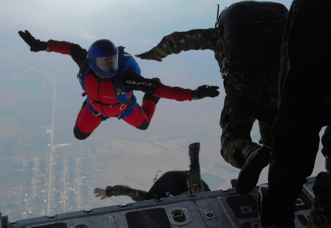 Romanian soldiers jump from an American KC-130 Hercules aircraft during training in Campia Turzii, Romania, May 15. The aviation combat element of Black Sea Rotational Force 12 facilitated the training by supplying the aircraft and crew.