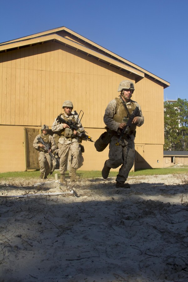 Marines of Company K, Battalion Landing Team (BLT) 3/2, currently reinforcing the 26th Marine Expeditionary Unit (MEU), egress from the objective during the mechanized raid course at Camp Lejeune, N.C., Oct. 10, 2012. BLT 3/2 is one of the three reinforcements of 26th MEU, which is slated to deploy in 2013.