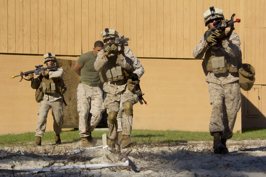 Marines of Company K, Battalion Landing Team (BLT) 3/2, currently reinforcing the 26th Marine Expeditionary Unit (MEU), egress from the objective during the mechanized raid course at Camp Lejeune, N.C., Oct. 10, 2012. BLT 3/2 is one of the three reinforcements of 26th MEU, which is slated to deploy in 2013.