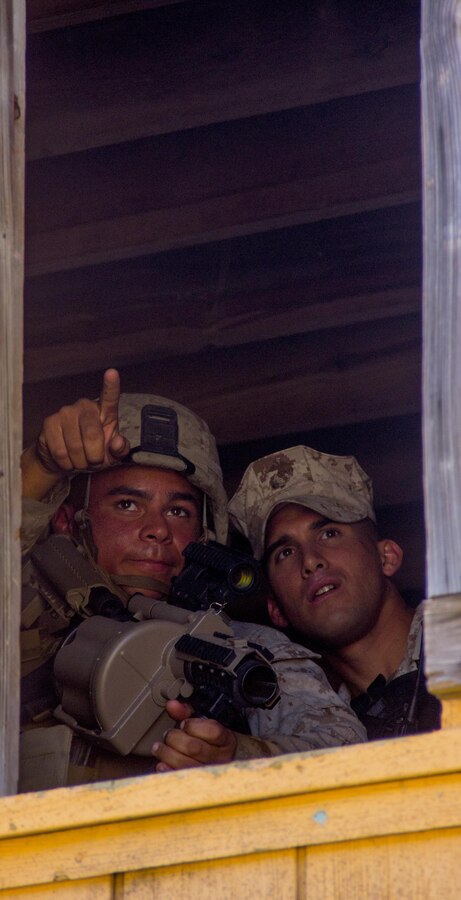 Marines of Company K, Battalion Landing Team (BLT) 3/2, currently reinforcing the 26th Marine Expeditionary Unit (MEU), indicate their intended target to an instructor during the mechanized raid course at Camp Lejeune, N.C., Oct. 10, 2012. BLT 3/2 is one of the three reinforcements of 26th MEU, which is slated to deploy in 2013.