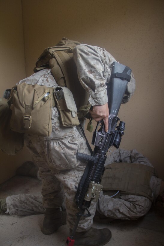 Marines of Company K, Battalion Landing Team (BLT) 3/2, currently reinforcing the 26th Marine Expeditionary Unit (MEU), subdue an enemy combatant during the mechanized raid course at Camp Lejeune, N.C., Oct. 10, 2012. BLT 3/2 is one of the three reinforcements of 26th MEU, which is slated to deploy in 2013. 