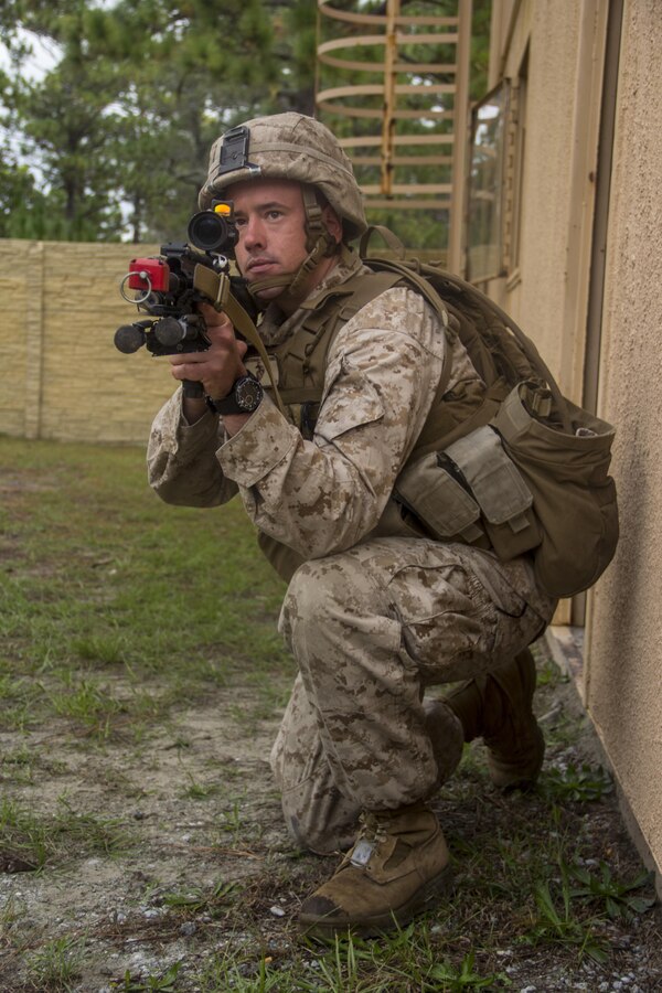 Pfc. Randy Kapacziewksi, infantry automatic rifle gunner with Company K, Battalion Landing Team (BLT) 3/2 from Bristol, Conn., currently reinforcing the 26th Marine Expeditionary Unit (MEU), provides security in an exercise during the mechanized raid course at Camp Lejeune, N.C., Oct. 10, 2012. BLT 3/2 is one of the three reinforcements of 26th MEU, which is slated to deploy in 2013.