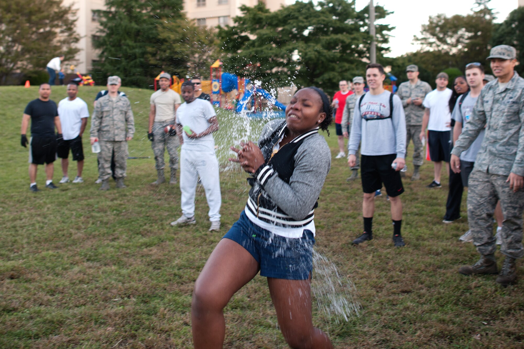 YOKOTA AIR BASE, Japan -- A water balloon burst on  Airman 1st Class Nicole Orr, 374th Maintenance Squadron, during the Combine Federal Campaign - Overseas' balloon toss competition at Yokota Air Base, Japan, Oct. 19, 2012. The goal for Yokota is to raise $275,000 for CFC-O.  (U.S. Air Force photo by Osakabe Yasuo)  