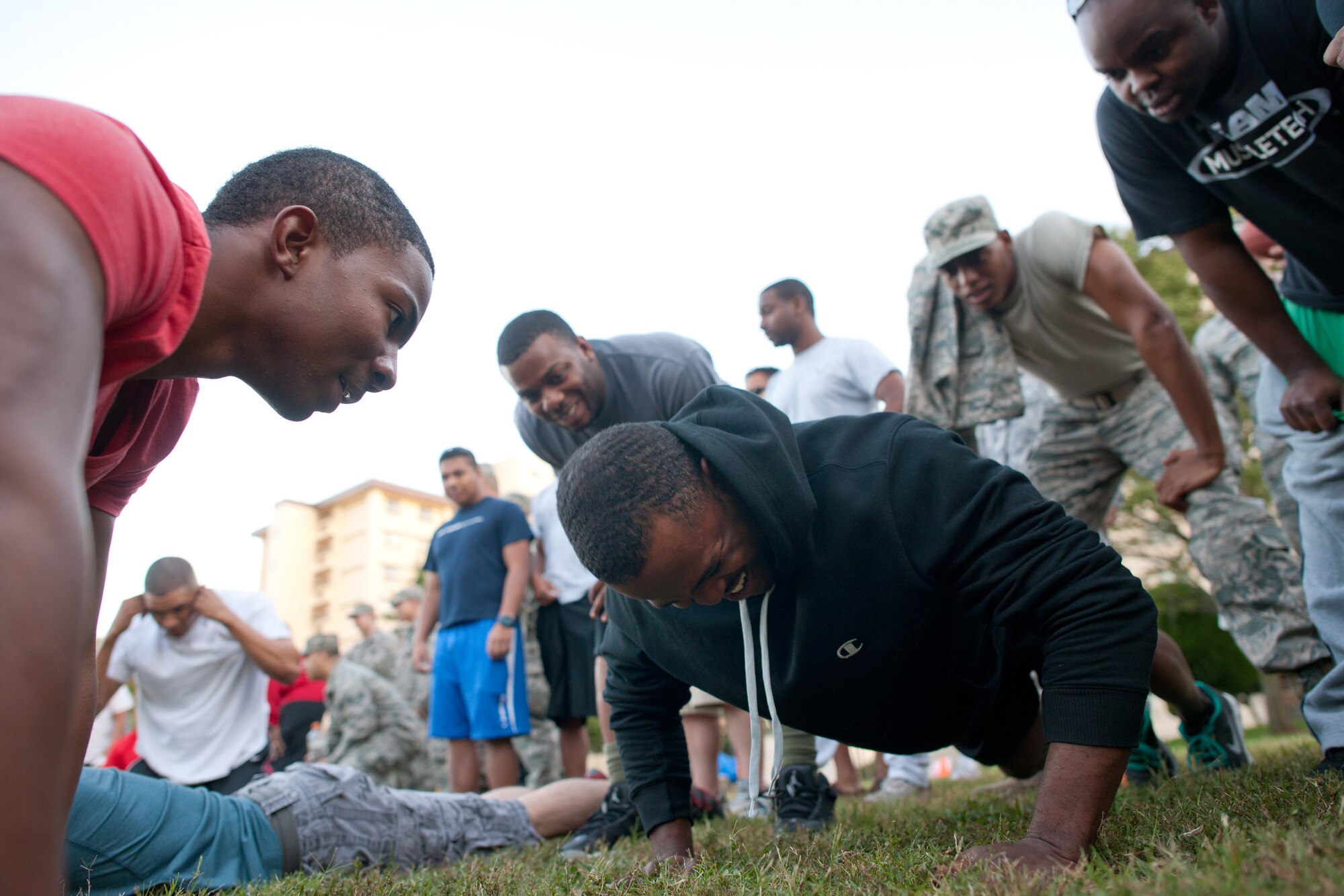YOKOTA AIR BASE, Japan -- Members from the 374th Logistics Readiness Squadron participate in a 10-minute push-up competition during the Combine Federal Campaign-Overseas promotion event at Yokota Air Base, Japan, Oct. 19, 2012.  Individuals can donate to the CFC until Nov. 16. (U.S. Air Force photo by Osakabe Yasuo) 