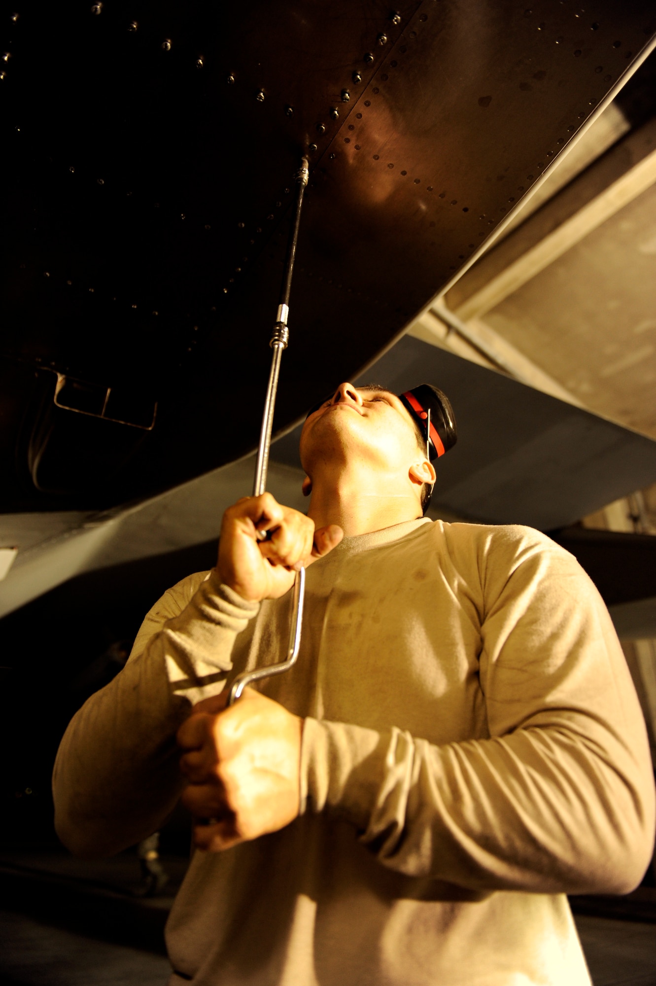 U.S. Air Force Staff Sgt. Jonathan Allison, 67th Aircraft Maintenance Unit crew chief, replaces a panel on an F-15C Eagle during Exercise Beverly Bearcat 12-1, a readiness inspection on Kadena Air Base, Japan, Oct. 22, 2012. The inspection is to ensure 18th Wing Airmen are meeting mission requirements for contingency operations within the Pacific theater. (U.S. Air Force photo/Senior Airman Maeson L. Elleman)