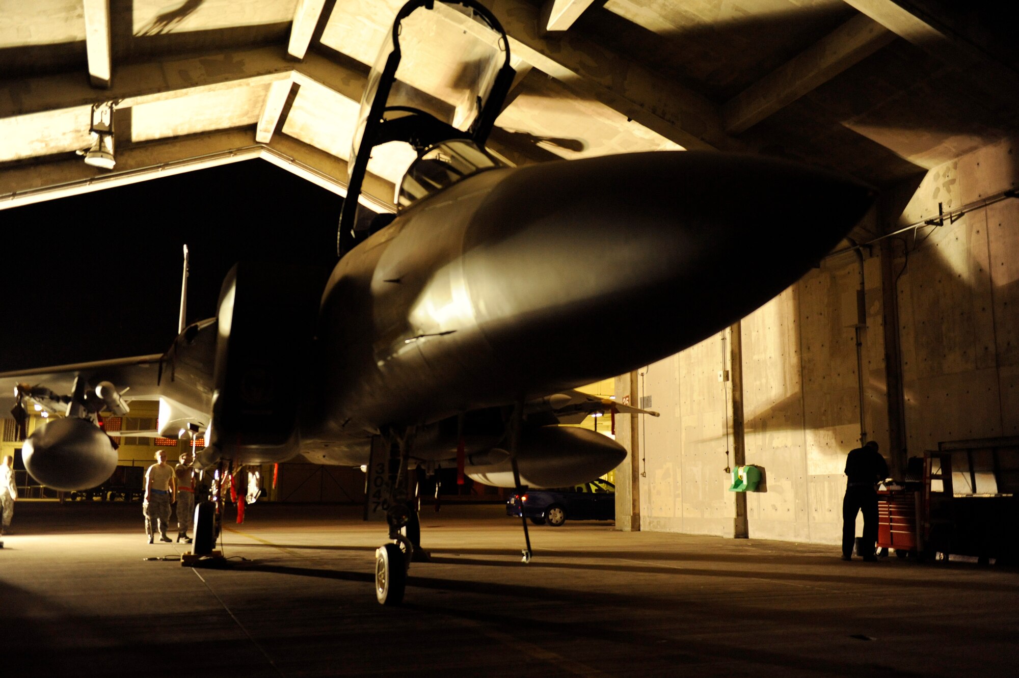 U.S. Air Force aircraft maintainers from the 18th Aircraft Maintenance Squadron perform routine maintenance on a U.S. Air Force F-15C Eagle during Exercise Beverly Bearcat 12-1, a readiness inspection on Kadena Air Base, Japan, Oct. 22, 2012. The inspection is to ensure 18th Wing Airmen are meeting mission requirements for contingency operations within the Pacific theater.  (U.S. Air Force photo/Senior Airman Maeson L. Elleman)