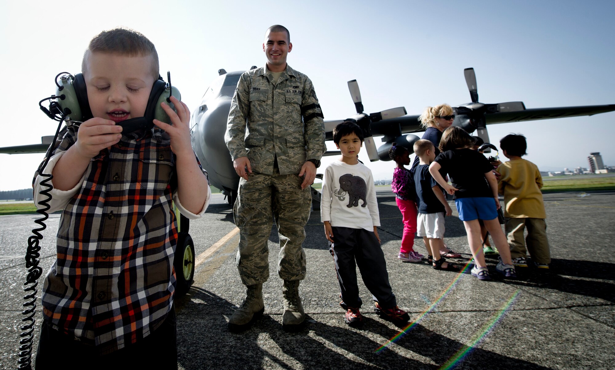 YOKOTA AIR BASE, Japan -- Isaiah Moless, a student at Joan K. Mendel Elementary School talks into a headset before a C-130 Hercules tour during Career Day at Yokota Air Base, Japan Oct. 16, 2012.  A variety of organizations from around the base participated in the event to share their insight and military experience with students. (U.S. Air Force photo by Staff Sgt Stacy Moless)    
