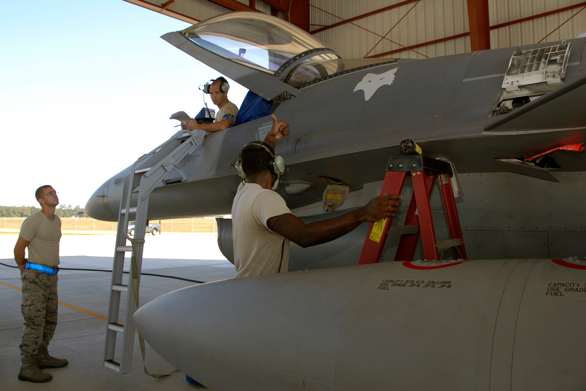 Senior Master Sgt. Brian Norris, a weapons inspector assigned to 1st AF from Tyndall Air Force Base, Fl., evaluates the 169th Fighter Wing's weapons load team during a weapons reliability check.  The McEntire team consists of Master Sgt. Jeremy Pow, team leader, and Senior Airmen Steven Hollis and Carlos Graham, all assigned to the 169th Fighter Wing's Aerospace Control Alert unit.  McEntire Joint National Guard Base's Aerospace Control Alert mission receives an AFOA inspection from 1AF/AFNORTH, Sept. 26, 2012.  McEntire is home of the Swamp Foxes of the South Carolina Air National Guard and the 169th Fighter Wing.  (National Guard Photo by Senior Master Sgt. Edward E. Snyder / Released)                           