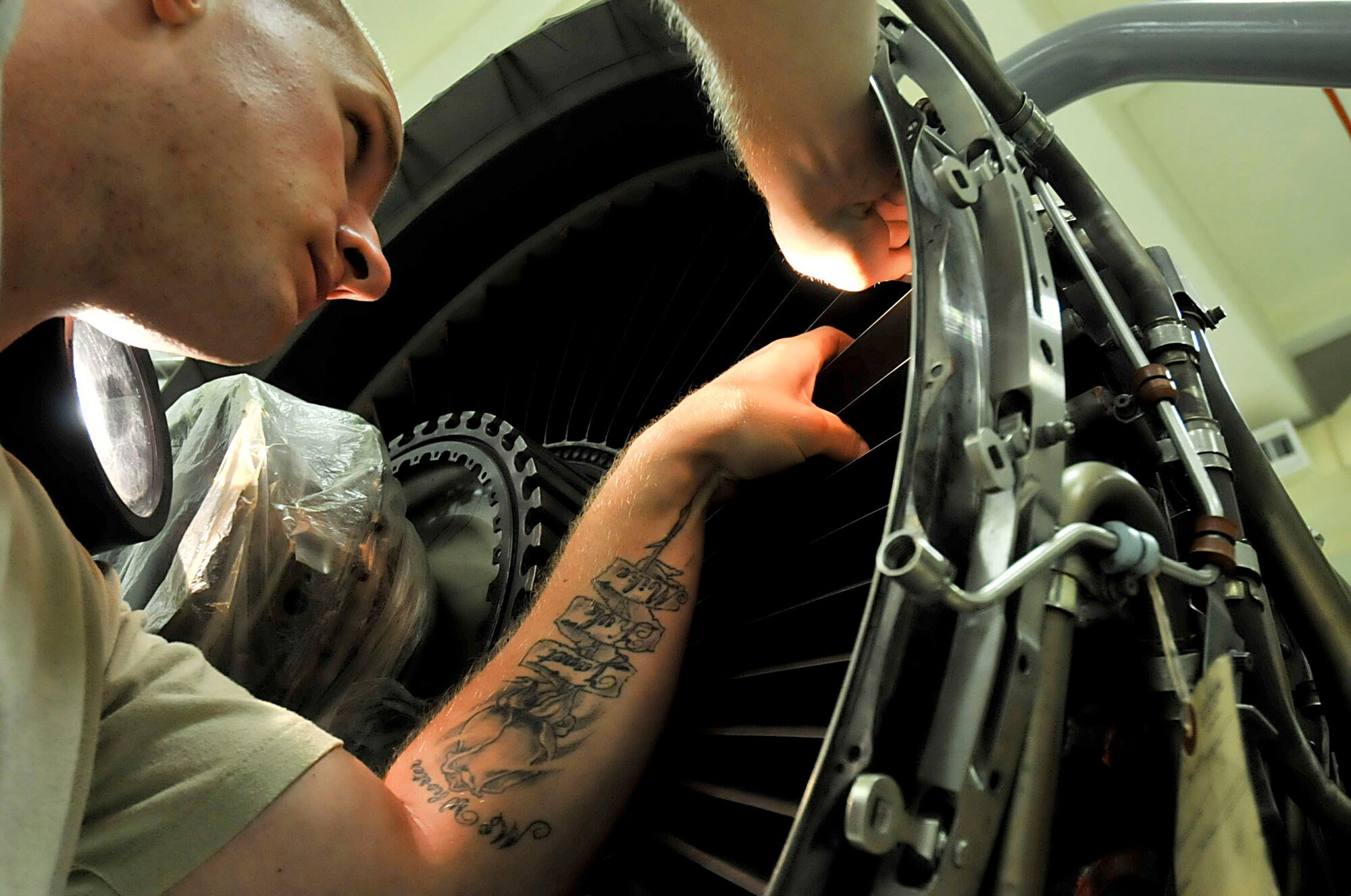 U.S. Air Force Senior Airman Corey McWhorter, 18th Component Maintenance Squadron aerospace propulsion journeyman, uses a flash light to inspect an F-15 Eagle fan for cracks during the second day of a Pacific Air Forces readiness inspection on Kadena Air Base, Japan, Oct. 23, 2012. Inspecting the blades ensures that the fan will work properly. The readiness inspection tests the 18th Wing on its ability to survive and operate during a contingency. (U.S. Air Force photo/Staff Sgt. Darnell T. Cannady)