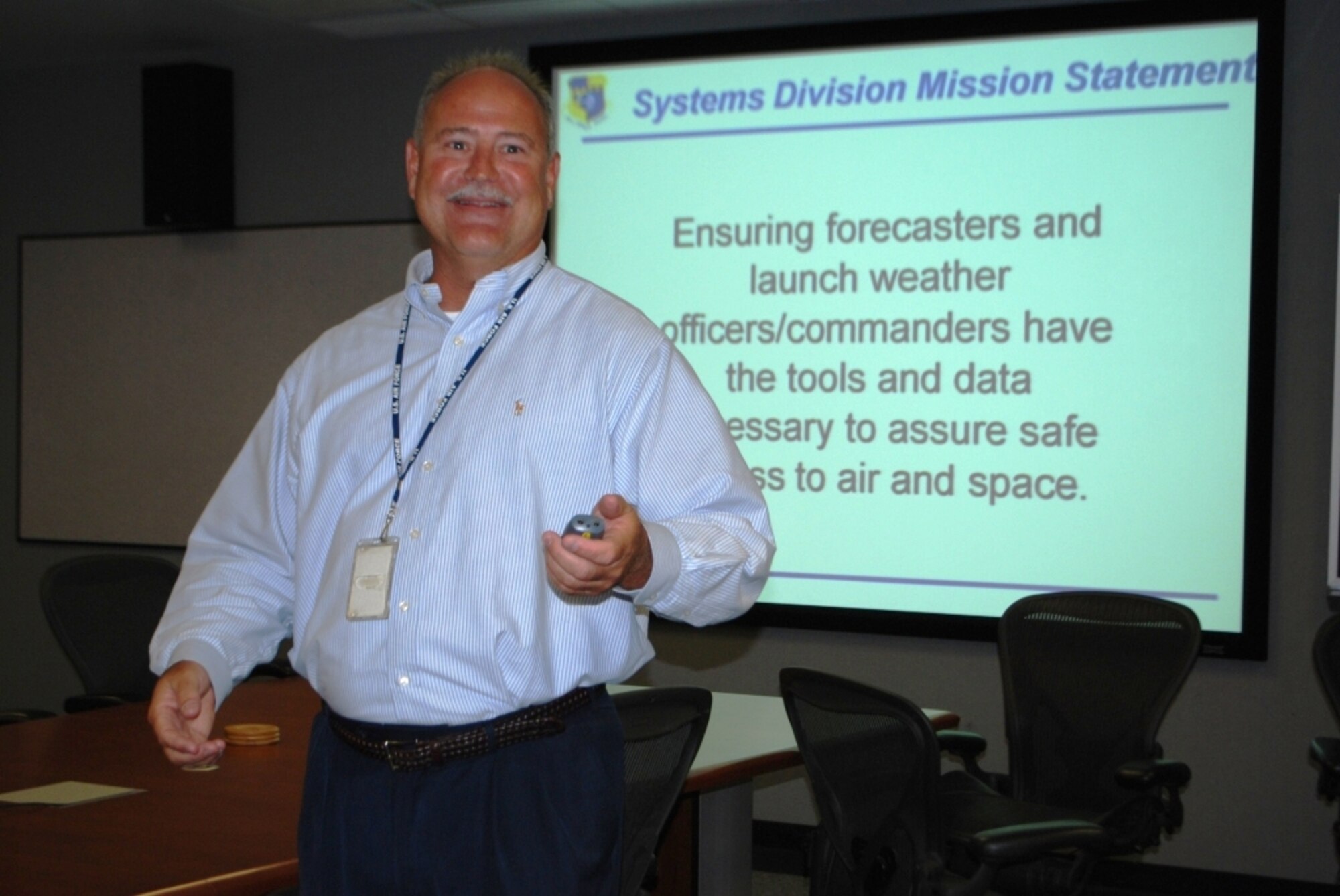 Jon Saul presents a systems briefing in the MOC's Conference Room. Col.
Steven Cahanin, commander, 45th Weather Squadron, thanked all the Airmen and
civilians who made the night a success, and personally thanked the Military
Affairs Council for all they do for all the service members stationed here
on the Space Coast.
