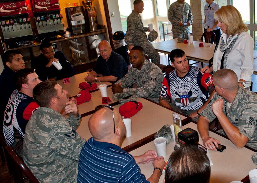 Sue Merchant, the spouse of Maj. Gen. Kenneth Merchant, the Air Force Armament Directorate program executive officer, introduces Wounded Warrior Amputee Softball Team players to the Eglin Air Force Base joint military softball team at Legends restaurant, Oct. 22. The two teams will face off to raise awareness of the sacrifices and resilience of our military on Nov. 3rd at Morgan Sports Center in Destin, Fla. (U.S. Air Force photo/Randy Gon)