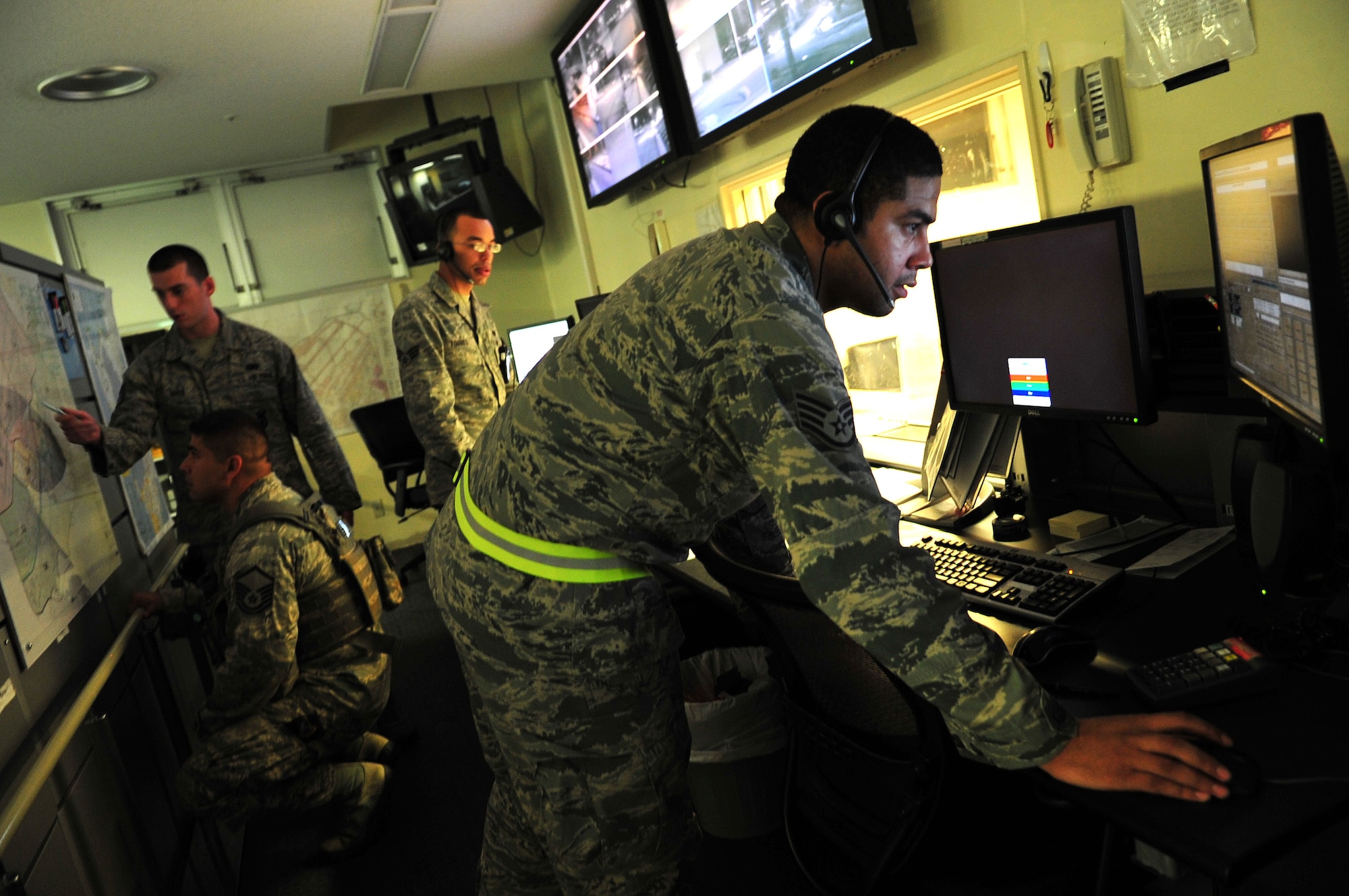Master Sgt. Jason Rangel, of the 18th Security Forces Squadron, and Staff Sgt. Joseph White, base defense operations center controller, plot traffic control points and other significant areas on maps as Senior Airman Alex Torres and Staff Sgt. John Munoz, also BDOC controllers, coordinate with Airmen on scene and review checklists during a Pacific Air Forces readiness inspection training scenario on Kadena Air Base, Japan, Oct. 23, 2012. The inspection tests Kadena’s ability to respond to and operate in simulated crisis conditions. (U.S. Air Force photo/Staff Sgt. Alesia Goosic) 