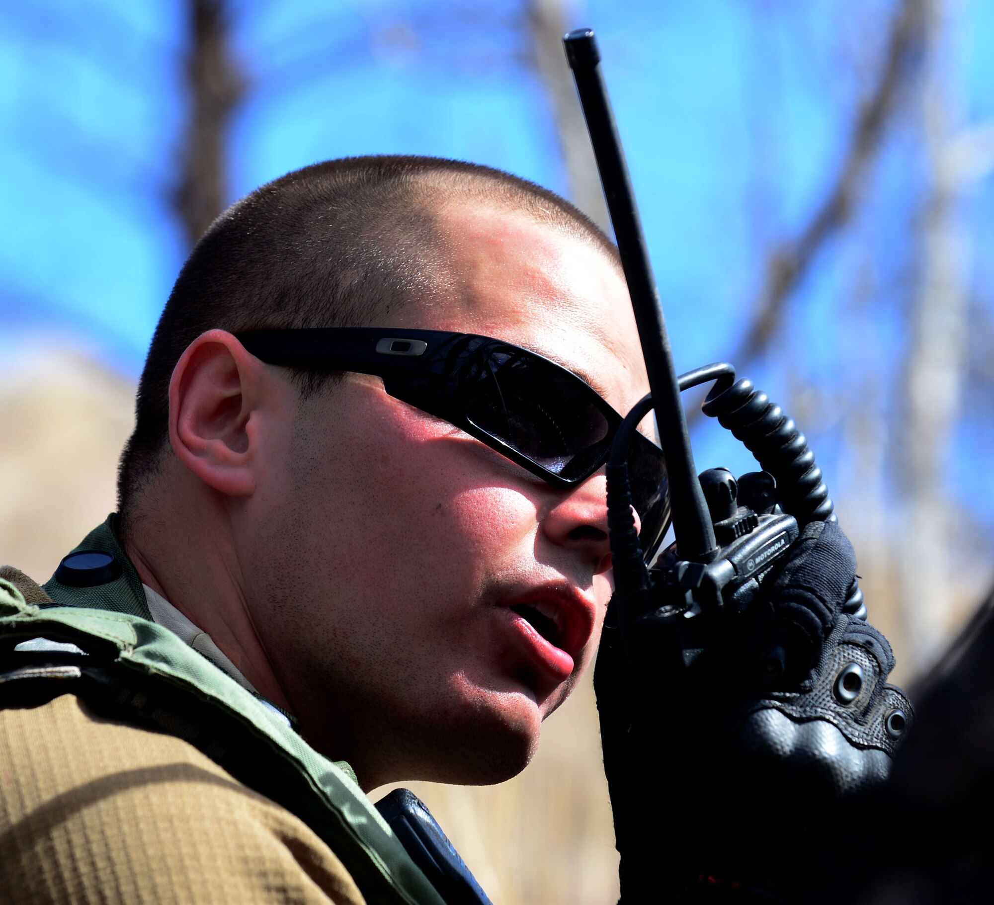 A Security Forces Airman, posing as an opposing force during Road Warrior, radios in a signal to team members at Camp Guernsey, Wyo., Oct. 19, 2012. Opposing force team members are tasked with stealing a nuclear resource from F.E. Warren Air Force Base, Wyo., Security Forces Airmen. (U.S. Air Force photo by Airman 1st Class Kayla Newman/Released)