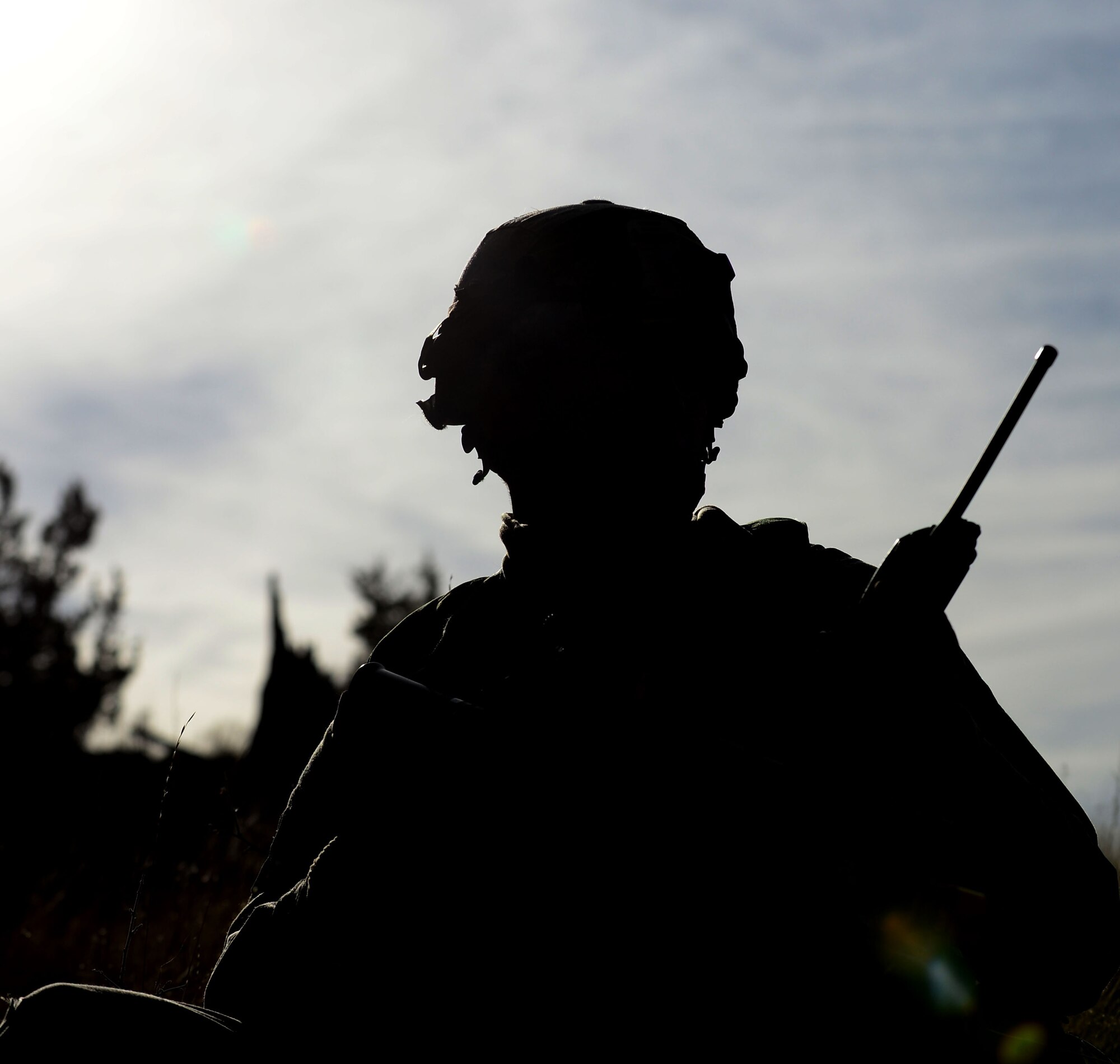 An Airman with the 790th Missile Security Forces Squadron radios in coordinates during Road Warrior at Camp Guernsey, Wyo., Oct. 19, 2012. Road Warrior is designed to teach Airmen how to protect a nuclear resource during a rolling convoy attack. (U.S. Air Force photo by Airman 1st Class Kayla Newman/Released)
