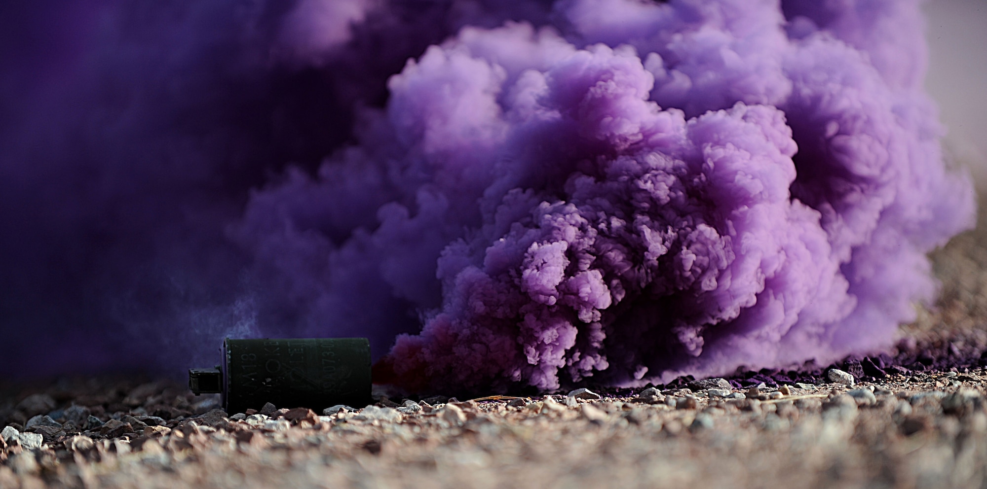A cloud of smoke is used to conceal the movements of Security Forces airmen from F.E. Warren Air Force Base, Wyo., during the Road Warrior exercise at Camp Guernsey, Wyo., Oct. 19, 2012. During the exercise, Airmen use various tactics to maintain the security of a nuclear convoy. (U.S. Air Force photo by Senior Airman Jarad A. Denton/Released)
