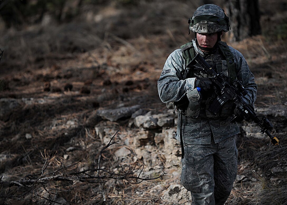 A Security Forces Airman from F.E. Warren Air Force Base, Wyo., searches for opposing forces during the Road Warrior Exercise at Camp Guernsey, Wyo., Oct. 19, 2012. During Road Warrior, Airmen are taught to tactically move over rough and uneven terrain while still maintaining security. (U.S. Air Force photo by Senior Airman Jarad A. Denton/Released)
