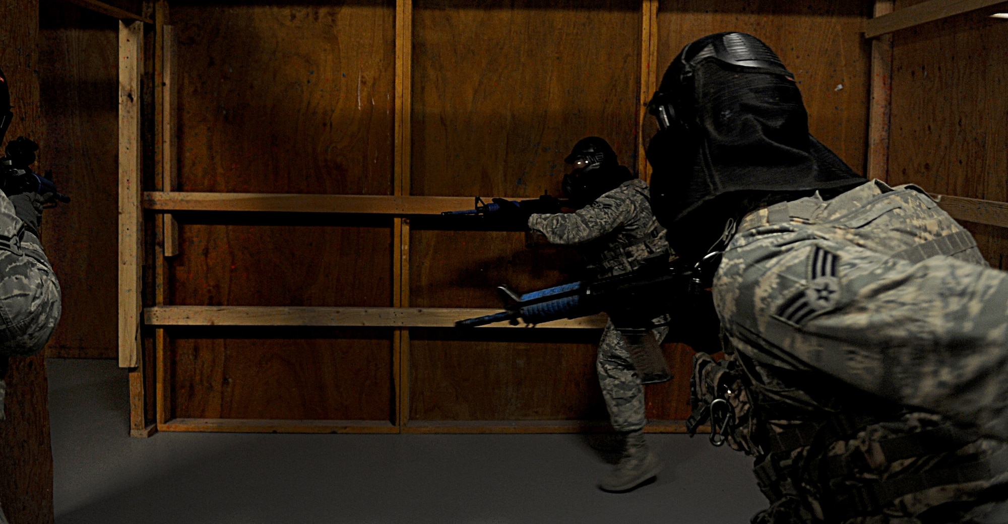 Security forces Airmen from F.E. Warren Air Force Base, Wyo., breach a room during a close-quarters combat class at Camp Guernsey, Wyo., Oct. 18, 2012. This class was part of a 10-day, nuclear-convoy training exercise called Road Warrior. (U.S. Air Force photo by Senior Airman Jarad A. Denton/Released)
