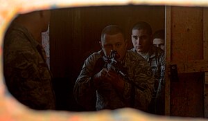 Security forces Airmen from F.E. Warren Air Force Base, Wyo. breach a room during a close-quarters combat class at Camp Guernsey, Wyo., Oct. 18, 2012. This class was part of a 10-day, nuclear-convoy training exercise called Road Warrior. (U.S. Air Force photo by Senior Airman Jarad A. Denton/Released)
