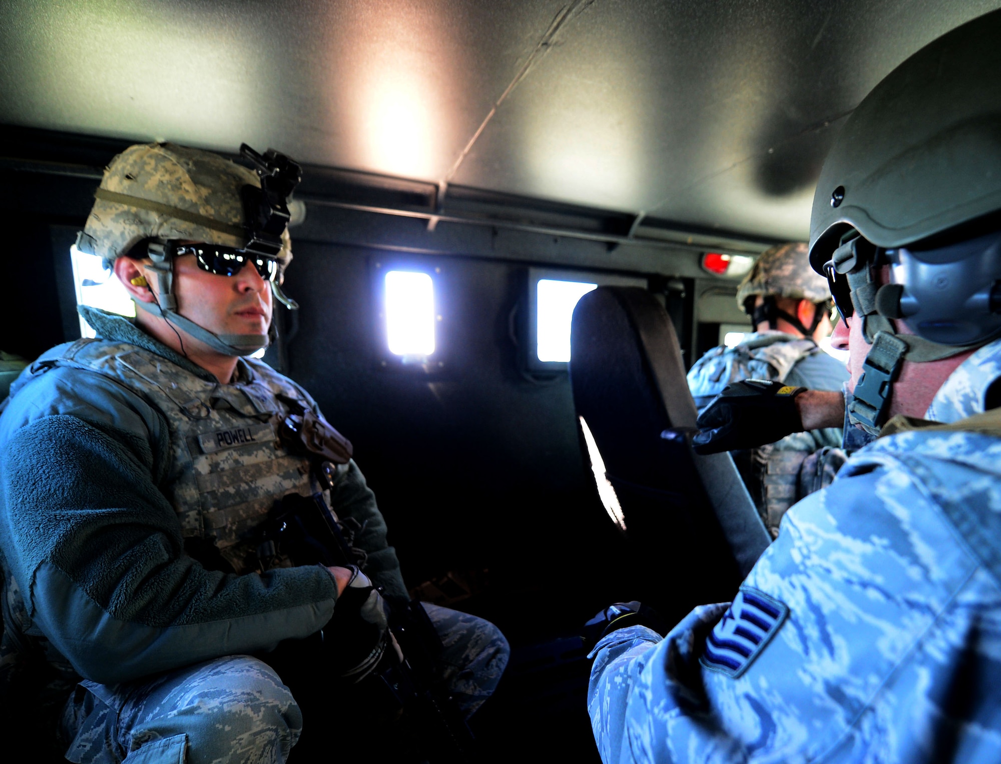 An instructor with the 620th Ground Combat Training Squadron briefs a Security Forces Airman from F.E. Warren Air Force Base, Wyo., during the third day of a 10-day nuclear-convoy training exercise at Camp Guernsey, Wyo., Oct. 17, 2012. The realistic training environment offers Airmen an opportunity to experience the noticeable difference between shooting while stationary, and shooting while in a moving vehicle. (U.S. Air Force photo by Airman 1st Class Kayla Newman/Released)