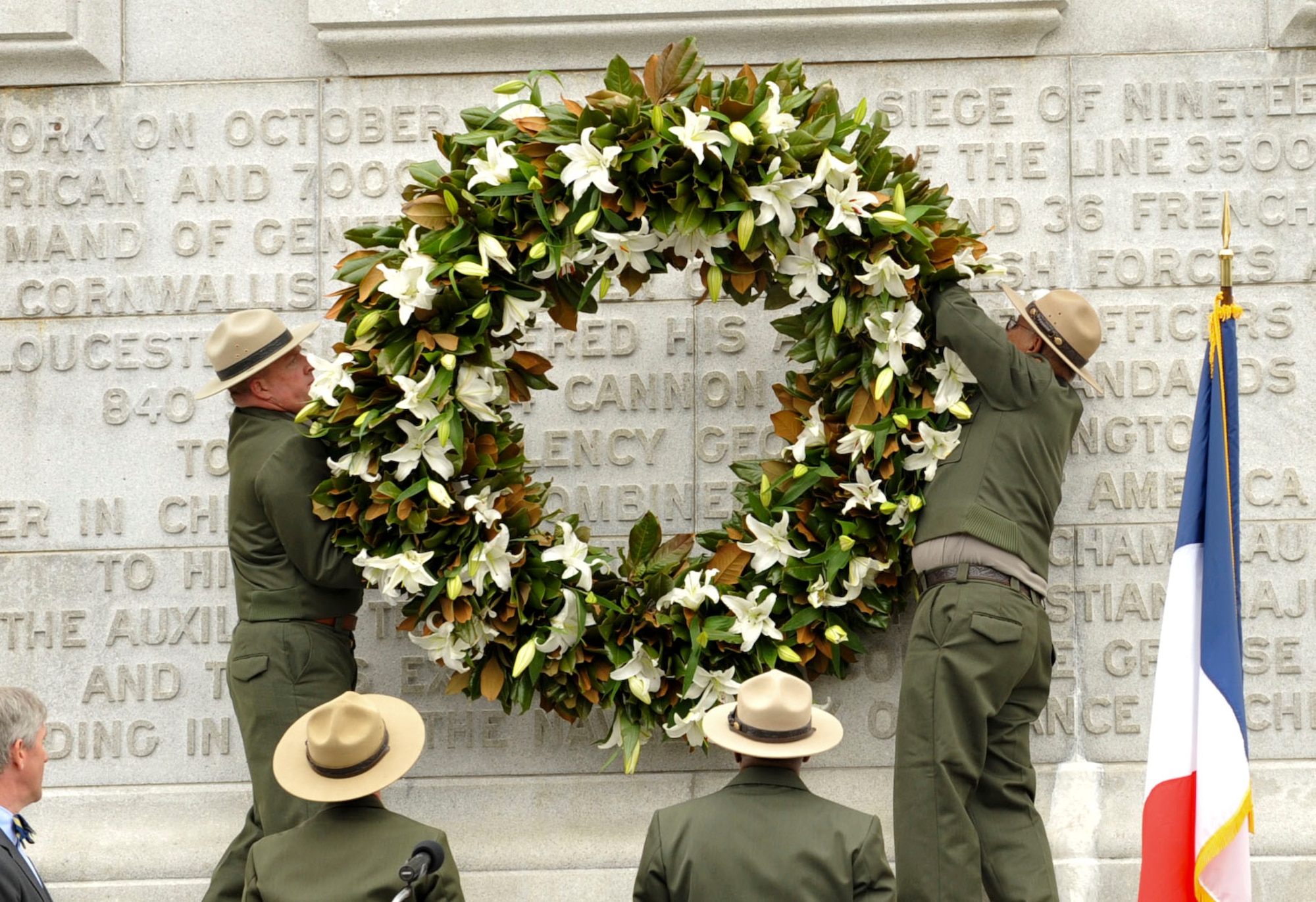 National Park Service Rangers hand a wreath on the monument in Yorktown, Va., as part of the annual Yorktown Day celebration, Oct. 19, 2012. Other festivities included a parade and a demonstration by the 3rd Infantry Regiment – Commander-in-Chief’s Guard, from Fort Myer, Va. (U.S. Air Force photo by Staff. Sgt. Wesley Farnsworth / Released)