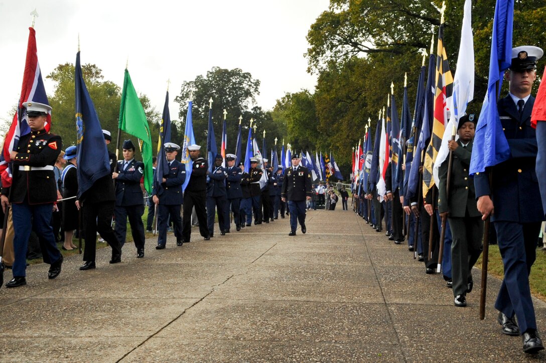Members from every branch of the U.S. military carry in flags from all 50 states during the patriotic ceremony at Yorktown, Va., as part of the Yorktown Day celebration, Oct. 19, 2012. Other festivities included a parade and a demonstration by the 3rd Infantry Regiment – Commander-in-Chief’s Guard, from Fort Myer, Va. (U.S. Air Force photo by Staff. Sgt. Wesley Farnsworth / Released)
