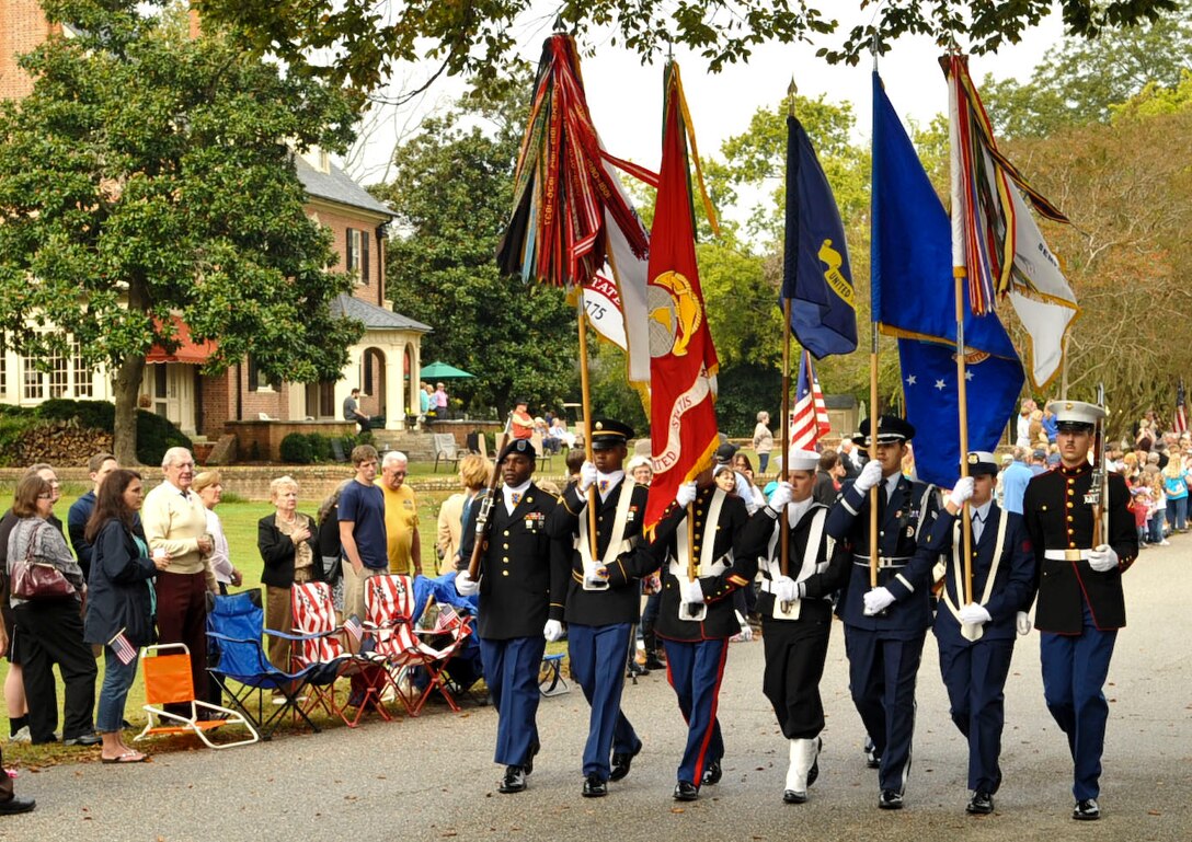 Members from every branch of the U.S. military form a joint color guard as they carry their respective service’s flag down main-street in Yorktown, Va., as part of the annual Yorktown Day parade, Oct. 19, 2012. Other festivities included a patriotic ceremony and a demonstration by the 3rd Infantry Regiment – Commander-in-Chief’s Guard, from Fort Myer, Va. (U.S. Air Force photo by Staff. Sgt. Wesley Farnsworth / Released) 