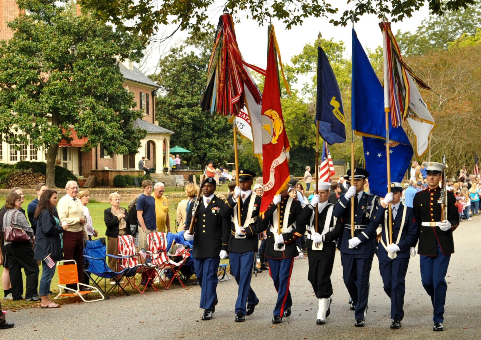 Members from every branch of the U.S. military form a joint color guard as they carry their respective service’s flag down main-street in Yorktown, Va., as part of the annual Yorktown Day parade, Oct. 19, 2012. Other festivities included a patriotic ceremony and a demonstration by the 3rd Infantry Regiment – Commander-in-Chief’s Guard, from Fort Myer, Va. (U.S. Air Force photo by Staff. Sgt. Wesley Farnsworth / Released) 