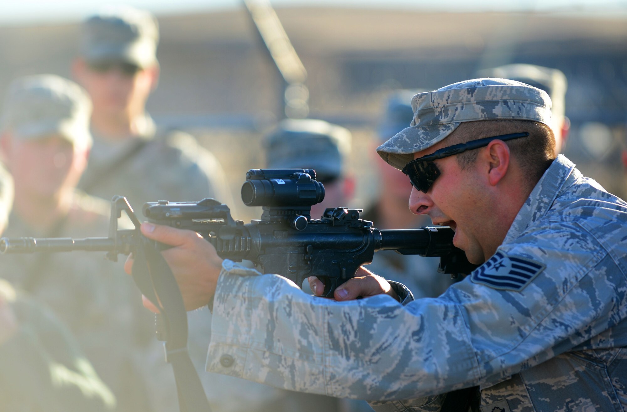 U.S. Air Force Tech. Sgt. William Hinchcliff, 620th Ground Combat Training Squadron nuclear training instructor, demonstrates the correct way to handle an M4 Carbine before Airmen fire at the South Range of Camp Guernsey, Wyo., Oct. 16, 2012. Airmen from F.E. Warren Air Force Base, Wyo., are participants in a 10-day, annual nuclear-convoy training exercise called Road Warrior. (U.S. Air Force photo by Airman 1st Class Kayla Newman/Released)