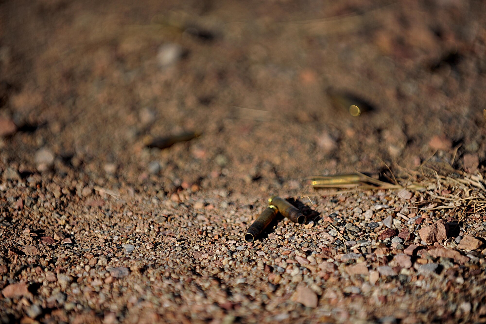 Spent ammunition casings lie on South Range of Camp Guernsey, Wyo., Oct. 16, 2012. The ammunition was fired as part of the weapons proficiency program of the 2012 Road Warrior exercise. (U.S. Air Force photo by Senior Airman Jarad A. Denton/Released)