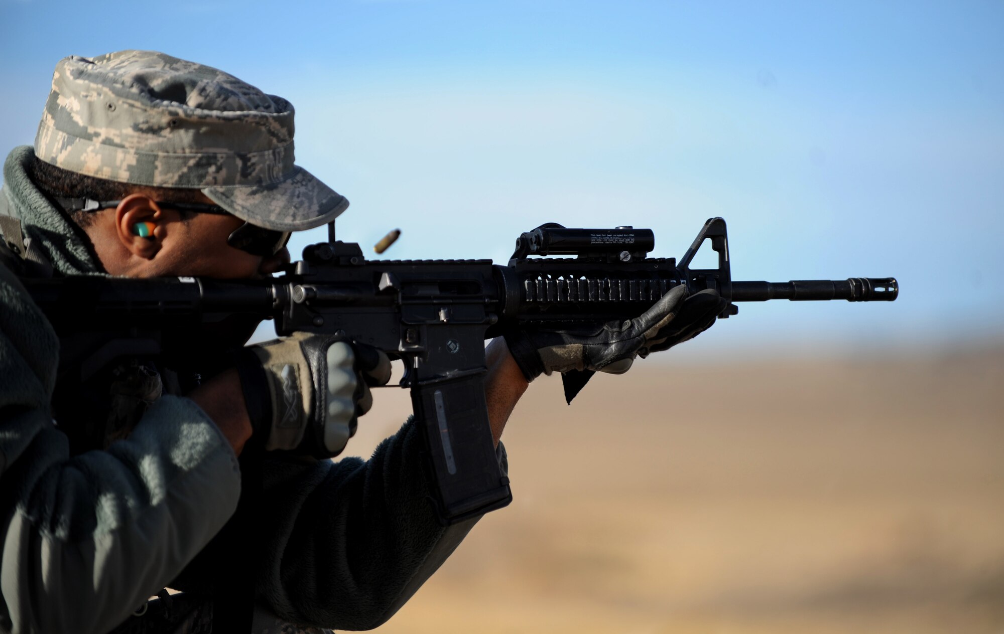 Senior Airman Sean Thornton, 790th Missile Security Forces Squadron convoy response force leader, fires his M4 Carbine during a training session at the South Range of Camp Guernsey, Wyo., Oct. 16, 2012. Airmen from F.E. Warren Air Force Base, Wyo. participated in a 10-day nuclear convoy training course at Camp Guernsey, called Road Warrior. (U.S. Air Force photo by Senior Airman Jarad A. Denton/Released)
