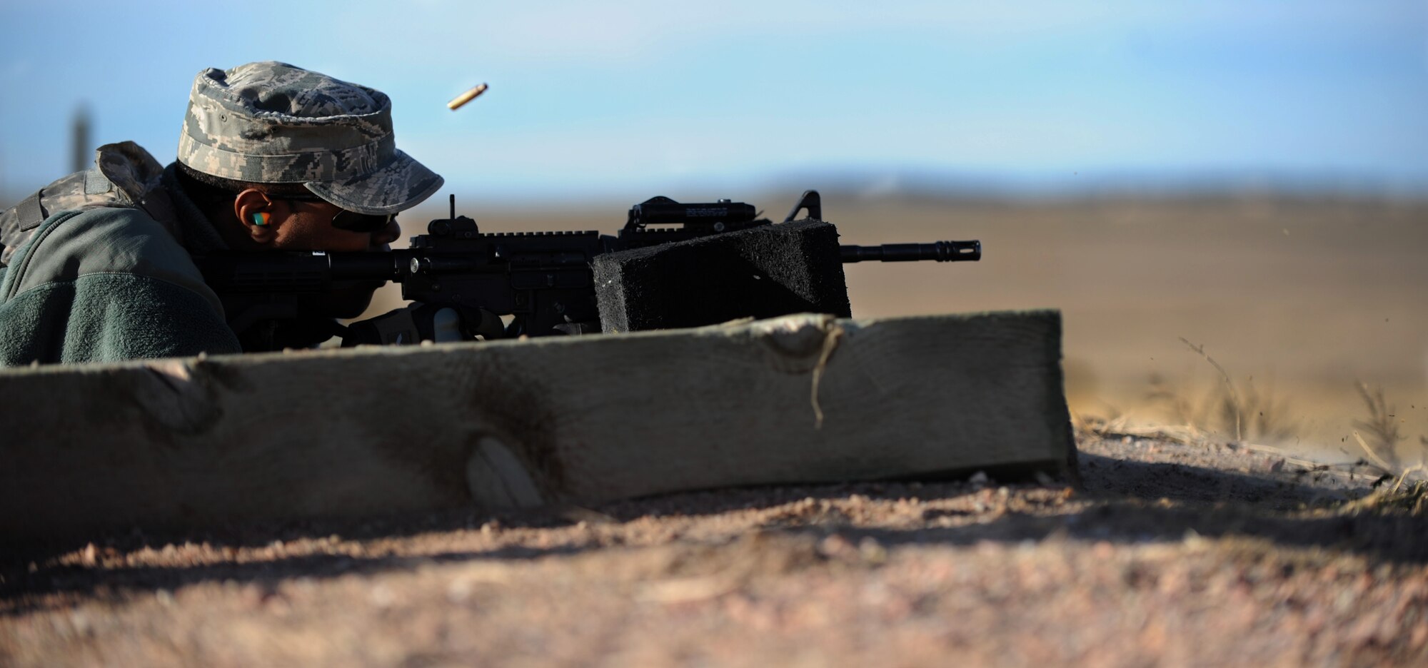 Senior Airman Sean Thornton, 790th Missile Security Forces Squadron convoy response force leader, fires his M4 Carbine during a training session at the South Range of Camp Guernsey, Wyo., Oct. 16, 2012. Thornton joined other Airmen from F.E. Warren Air Force Base, Wyo. for the 10-day Road Warrior exercise at Camp Guernsey. (U.S. Air Force photo by Senior Airman Jarad A. Denton/Released)