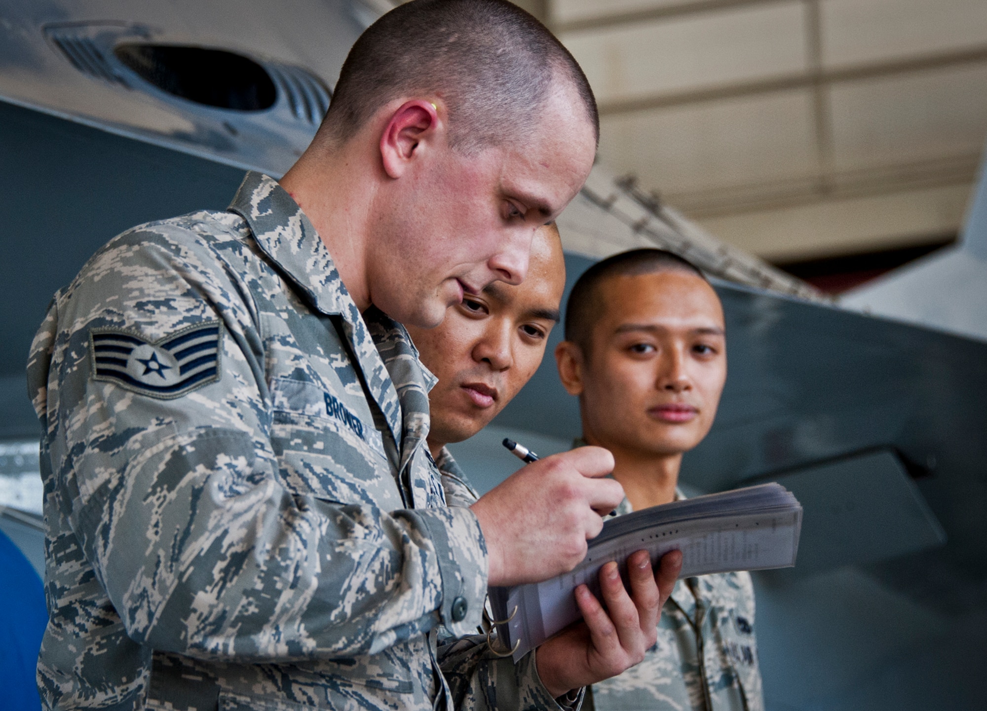 Staff Sgt. James Brower, of the 96th Aircraft Maintenance Squadron, and his team review their checklist one last time before they announce they’ve completed the weapons load competition Oct. 19 at Eglin Air Force Base, Fla.  Brower and his F-16 team competed in the quarterly competition against an F-15 load crew team.  The competition was measured by how quickly, safely and accurately the teams loaded an MK-82 and an AIM-9M to their respective aircraft.  (U.S. Air Force photo/Samuel King Jr.)