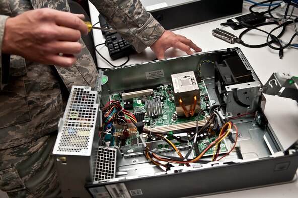 Senior Airman Travis Mollema, 28th Communications Squadron client system technician, troubleshoots a computer at Ellsworth Air Force Base, S.D., Oct. 16, 2012. When network or computer problems arise, 28th CS client system technicians troubleshoot problems to find solutions and bring systems online quickly. (U.S. Air Force photo by Airman 1st Class Zachary Hada/Released)