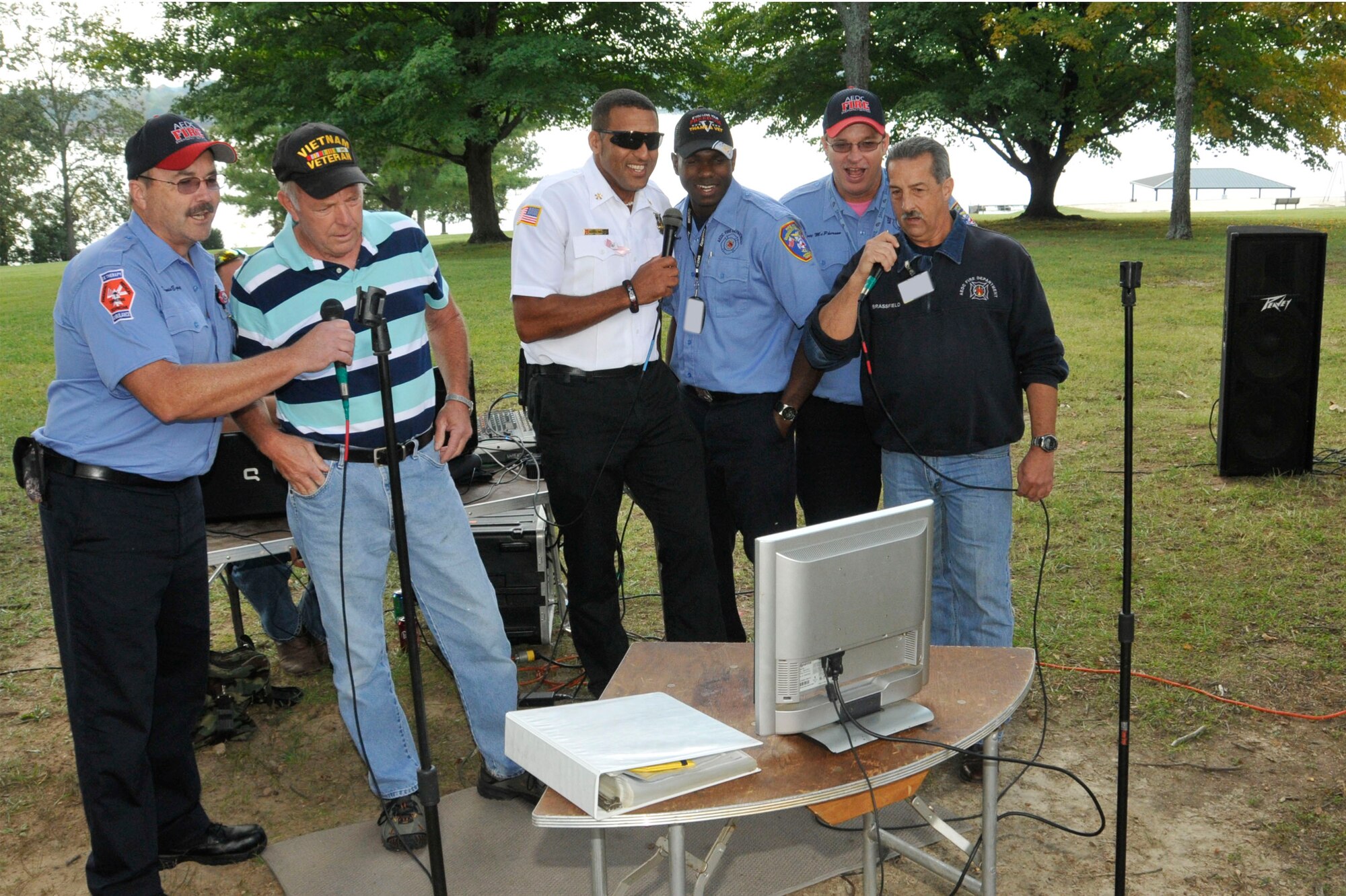 From left, Arnold AFB Fire Department firefighter crew chief Dennis Eggert; retired driver operator and Vietnam veteran Darnell Ortner; firefighter George DeShields; and crew chief Joe Brassfield sang for the veterans attending Arnold’s annual VA picnic Oct. 4. (Photo by Rick Goodfriend)