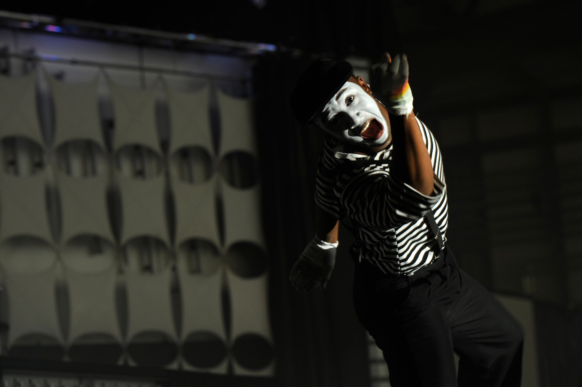 Airman 1st Class Jonathan Leak plays a mime during a skit while on tour with Tops in Blue at Ramstein Air Base, Germany, Oct. 21, 2012. The Tops in Blue 2012 World Tour, entitled “Listen,” has traveled across the United States and over 20 different countries. (U.S. Air Force photo/ Senior Airman Aaron-Forrest Wainwright)