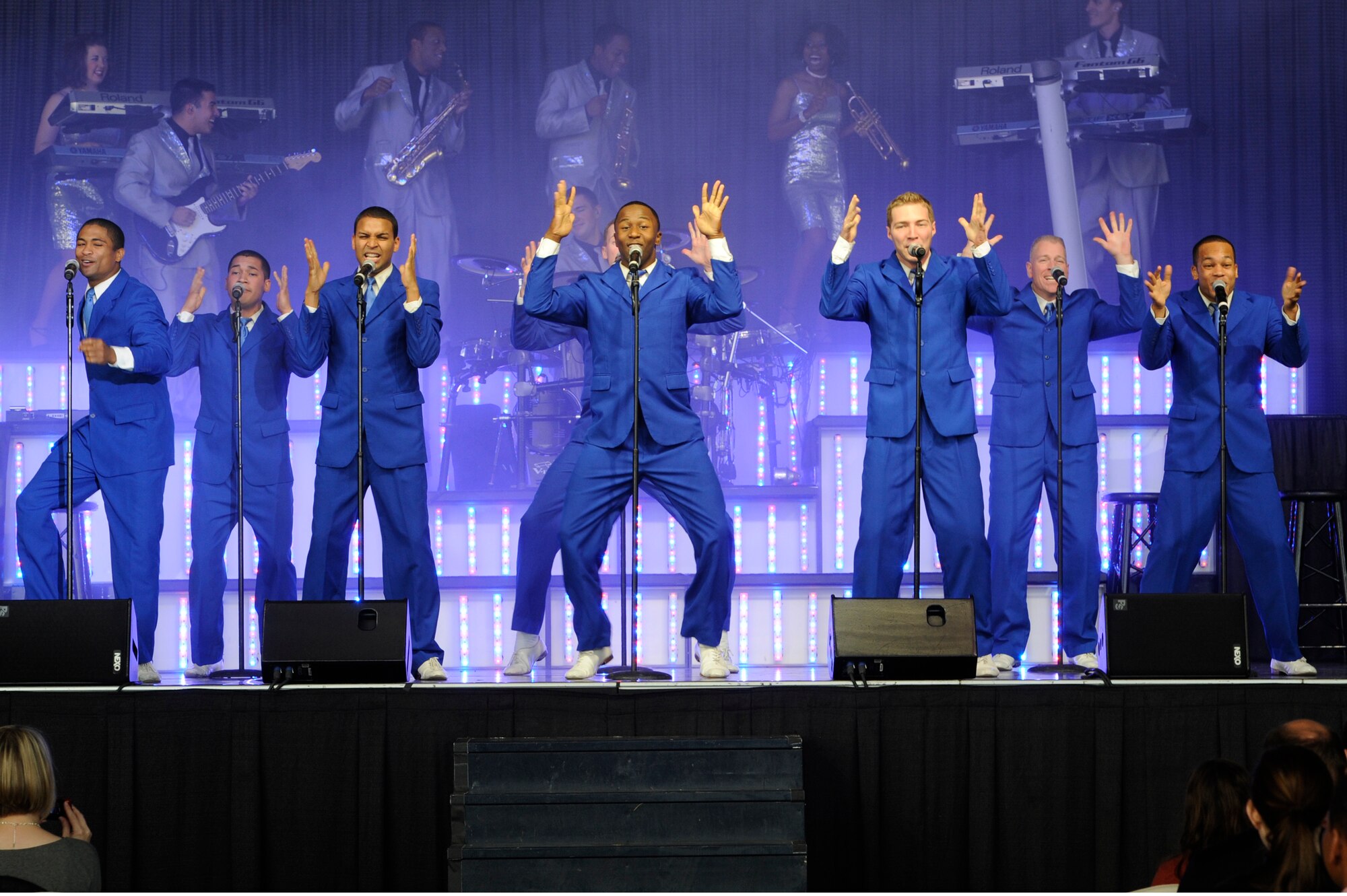 Members of Tops and Blue perform at the duel-bay hangar on tour at Ramstein Air Base, Germany, Oct. 21, 2012. The Tops in Blue 2012 World Tour, entitled “Listen,” has traveled across the United States and over 20 different countries. (U.S. Air Force photo/ Senior Airman Aaron-Forrest Wainwright)