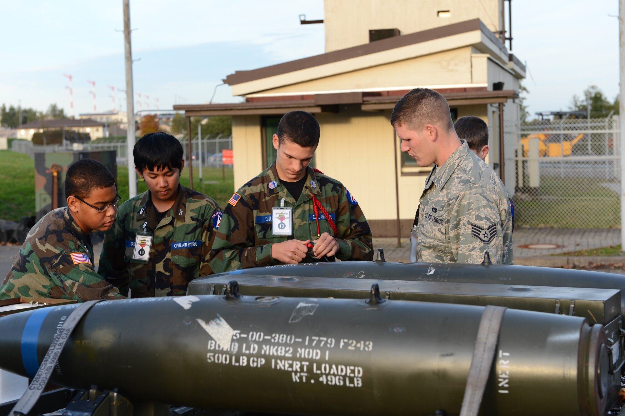 SPANGDAHLEM AIR BASE, Germany – Cadets from the Spangdahlem Civil Air Patrol build an inert Mark 82 bomb during their tour of the 52nd Equipment Maintenance Squadron conventional maintenance shop Oct. 19, 2012. The cadets got the chance to assemble a laser-targeting system, inert fuse and tail fins on an inert bomb. (U.S. Air Force photo by Airman 1st Class Dillon Davis/Released)