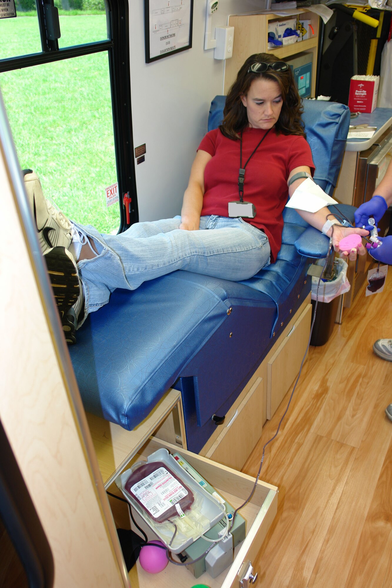 Nicki Morris, an Aerospace Testing Alliance (ATA) engineering technician and blood donor, waits as her donation process completes during the last bloodmobile visit. (Photo by Patrick Ary)