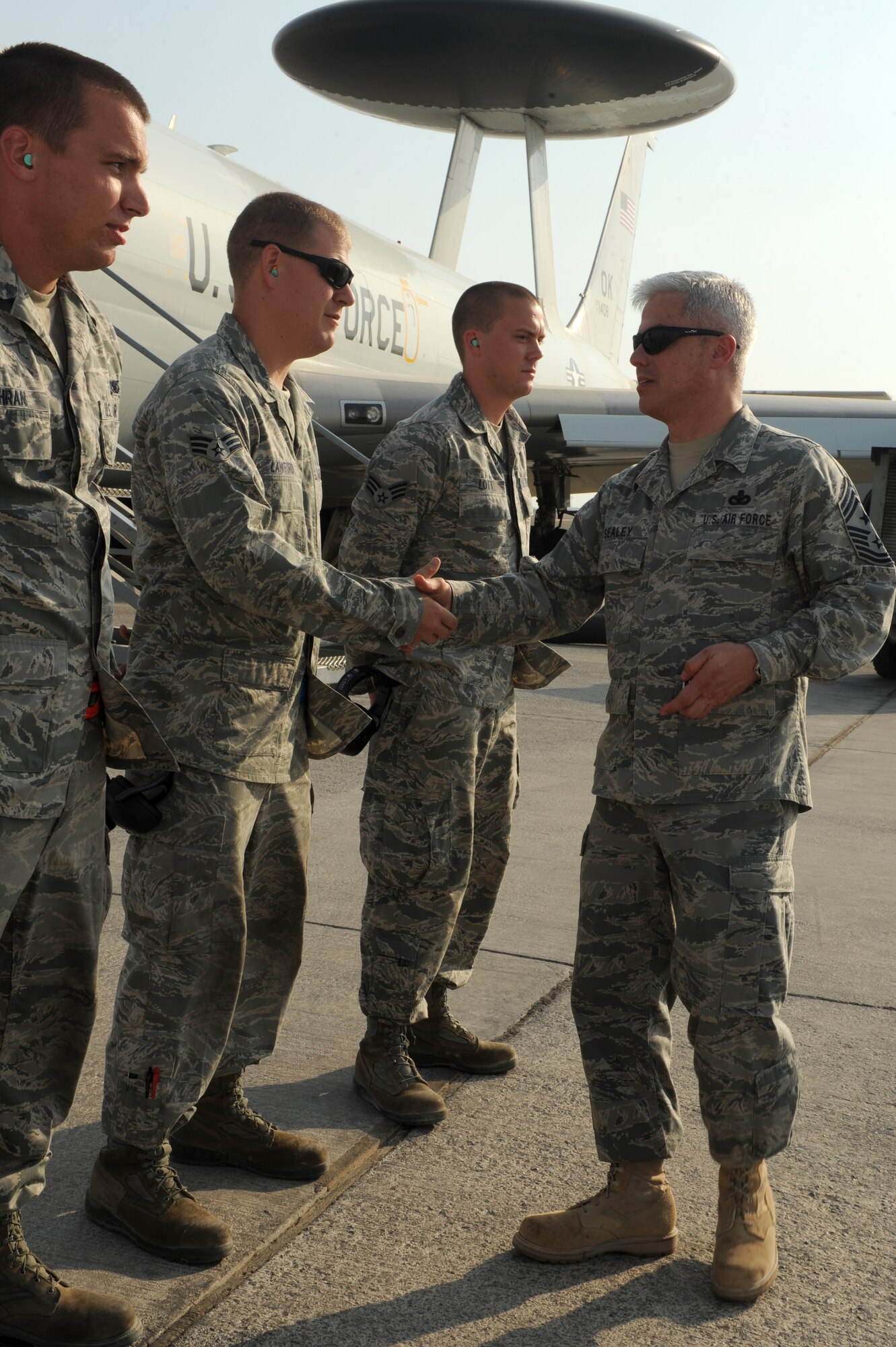 SOUTHWEST ASIA - U.S. Air Force Chief Master Sgt. Robert Sealey, U.S. Air Forces Central Command command chief, shakes hands with members of the 970th Expeditionary Airborne Air Control Squadron Oct. 17, 2012. Sealey toured the flightline and visited several units across the wing during his visit.  (U.S. Air Force photo/Master Sgt. Scott MacKay)