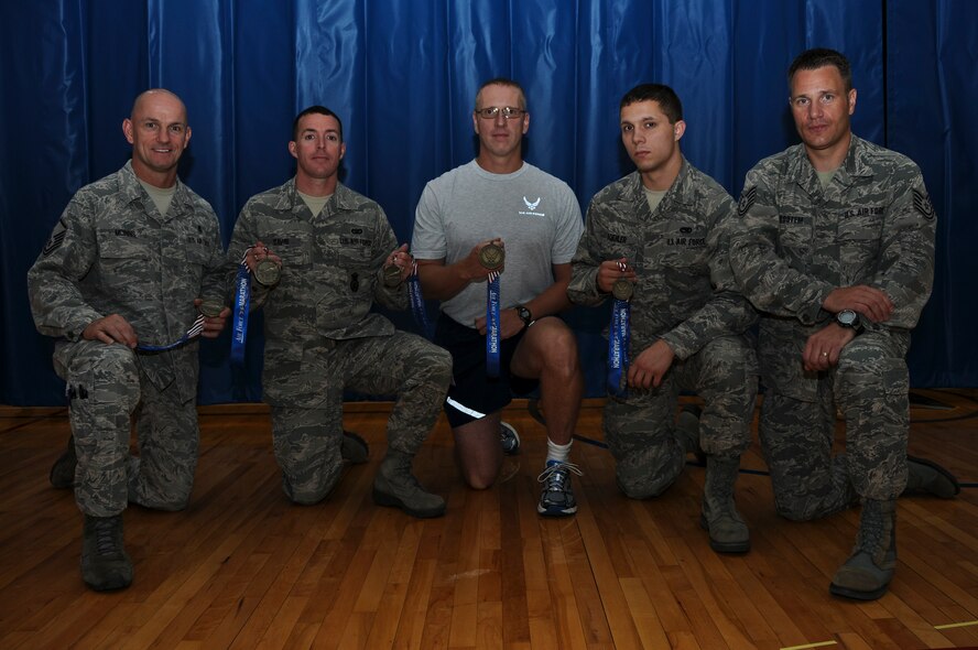 Several members of the 911th Airlift Wing competed in this year’s Air Force Marathon held at Wright Patterson AFB, Dayton, Ohio, Sept. 15, 2012. Every participant from the 911th finished the race, in either full or half marathon categories, receiving a medal for their achievement. From left to right: Senior Master Sgt. Paul Mcinnis; Senior Airman John Davis; Master Sgt. John Lee; Senior Airman Stephen Koehler and Tech. Sgt. Ralph Van Houtem. Not pictured: Senior Master Sgt. John Szydel; Senior Master Sgt. Michael Rothwell; Tech. Sgt. Jessica Davis and Staff Sgt. Susan Turek. (U.S. Air Force photo by Senior Airman Joshua J. Seybert/Released)