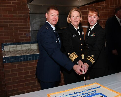 Col. Craig Peters, 911th Airlift Wing commander; Vice Adm. Robin Braun, Chief of Navy Reserve Commander, Navy Reserve Force; and Lt. Cmdr. Denise Judge, Navy Operational Support Center Pittsburgh commanding officer cut the ceremonial cake at the conclusion of the NOSC groundbreaking ceremony Oct. 11, 2012 at the Pittsburgh International Airport Air Reserve Station.  The new NOSC facility will relocate from its current location in North Versailles, Pa. to the home of the 911th Airlift Wing in Moon Twp.  NOSC Pittsburgh is phase one of a multi-phased project intended to house the long-awaited Joint Readiness Training Center (JRTC), all of which will be located at the home of the  911th Airlift Wing in Moon Twp.  A strategic hub for homeland defense and emergency response efforts, phase one of JRTC - Pittsburgh, begins with the NOSC's relocation from North Versailles to their new home within the military community of the Airport Corridor. Construction should take approximately 16 months, with completion slated for early 2014. (U.S. Air Force photo by Tech. Sgt. Ralph Van Houtem/Released)