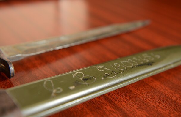 A bayonet and sheath belonging to U.S. Army Pfc. Clyde Sparks lay on a table at the 606th Air Control Squadron Oct. 4, 2012. Sparks lost the bayonet in Luxembourg in 1944, and after 68 years the bayonet was returned to his family. (U.S. Air Force photo by Staff Sgt. Nathanael Callon)