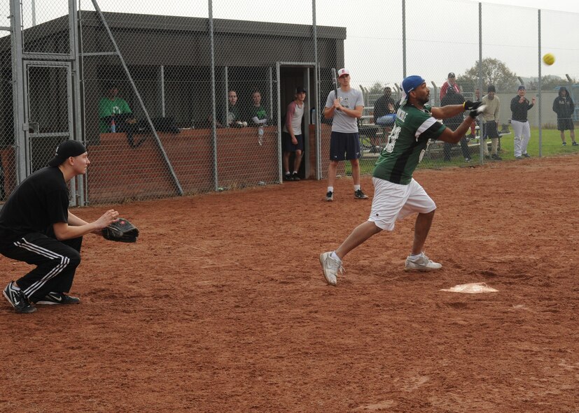 A player from the 56th Maintenance Group, RAF Lakenheath, softball team bats during the Toys for Tots charity softball tournament on Oct. 21, 2012 on RAF Mildenhall, England. The 56th MXG played against the 100th Civil Engineering Squadron and lost the game by one run in the last inning. The overall winners of the tournament was the 100th Security Forces Squadron team from RAF Mildenhall who beat the 48th Operations Support Squadron from RAF Lakenheath with a score of 24-17 during the championship game. (U.S. Air Force photo by Airmen 1st Class Kelsey A. Waters)
